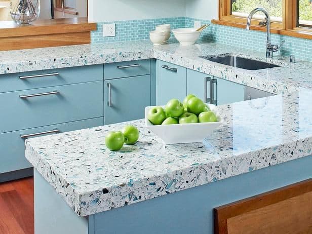 Bright patterned kitchen countertops blend seamlessly with existing wooden elements.