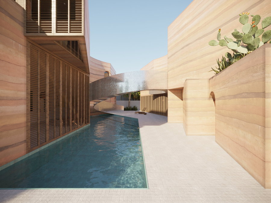 The rammed earth house's central courtyard boasts a beautiful swimming pool and shimmering spiral staircase.