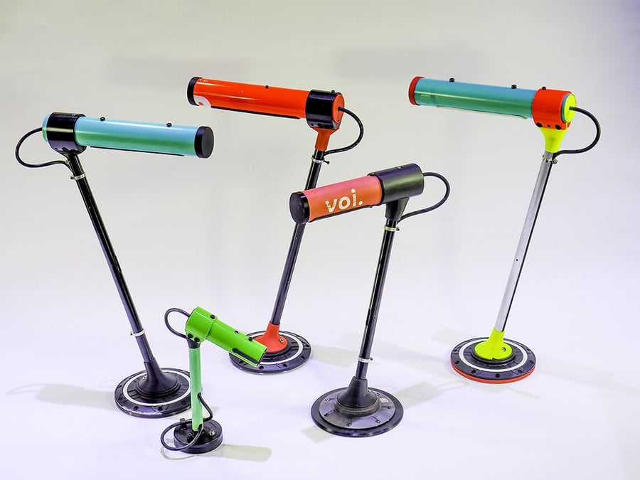 Colorful desk lamps made from parts of repurposed e-scooters as part of the Andra Formen project.