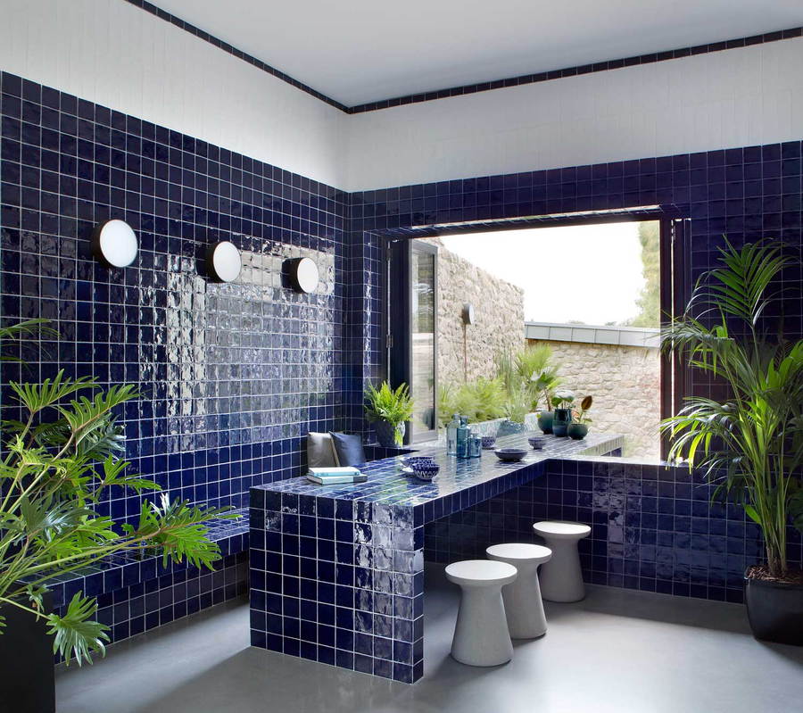 A calming blue tiled room inside the renovated Bolton Carriage House.