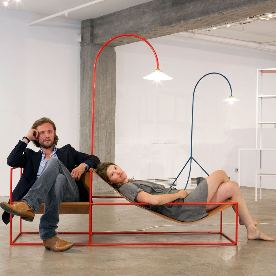 The duo that comprises Muller Van Severen kicks back on one of their sculptural dual seats.