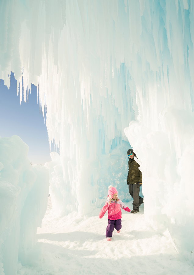 Families play inside the frosty walls of Brent Christensen's ice castles.