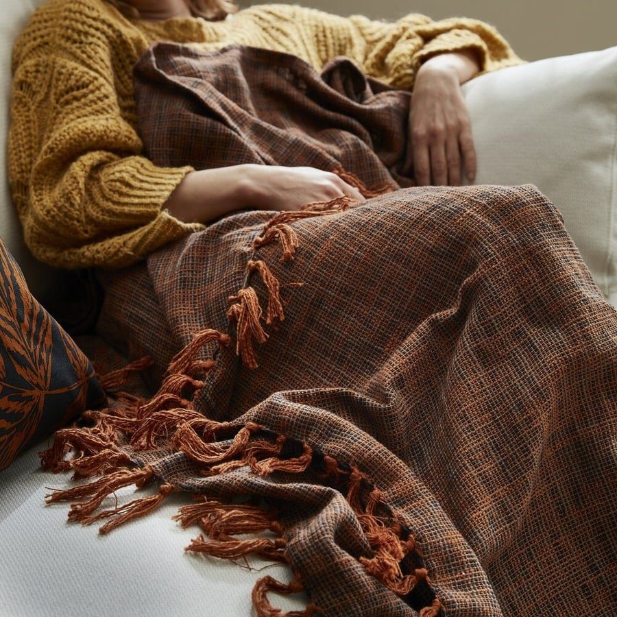 This thick brown IKEA Höstkvall blanket is perfect for watching scary movies under. 