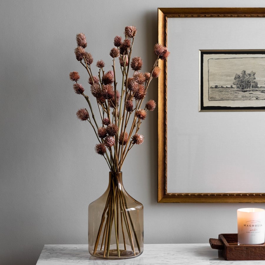 A dried natural decor bunch featured in Magnolia's fall furniture collection. 