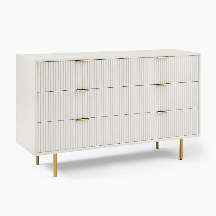 West Elm’s Quinn Lacquer 6-Drawer Dresser features fluted drawer fronts, metal hardware, and thin metal legs.