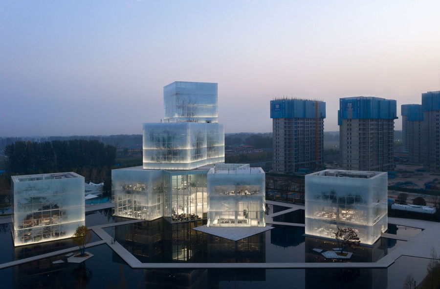 The ice cube-like Xinxiang Tourism Center emits a surprisingly warm glow come evening.