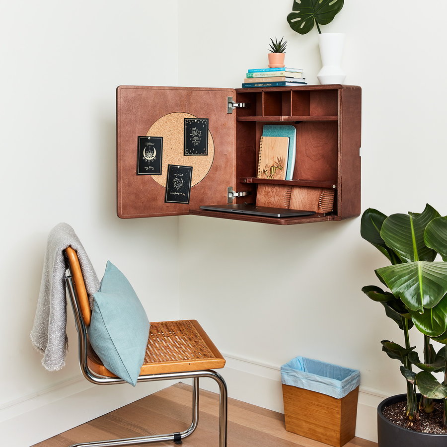 Don't have enough space to commit a full room to a home office? Consider one of these snazzy foldable secretary desks for your wall!