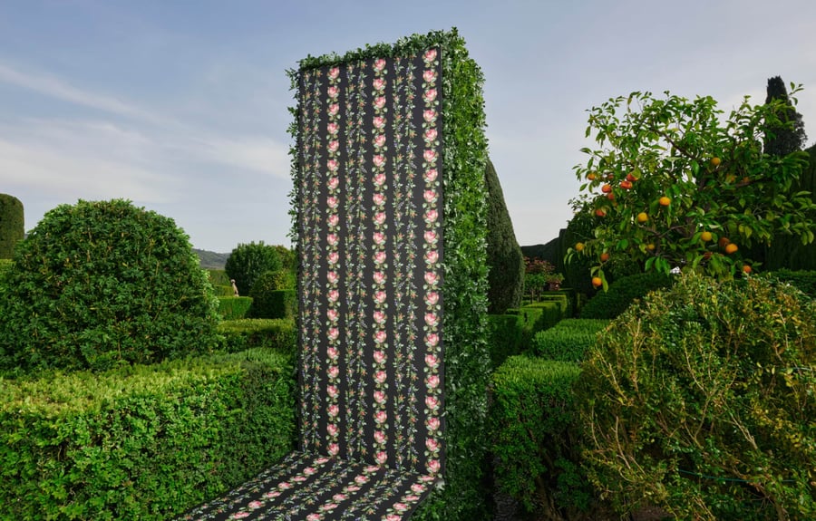Beautiful floral pattern printed along the side of a garden hedge as part of the 