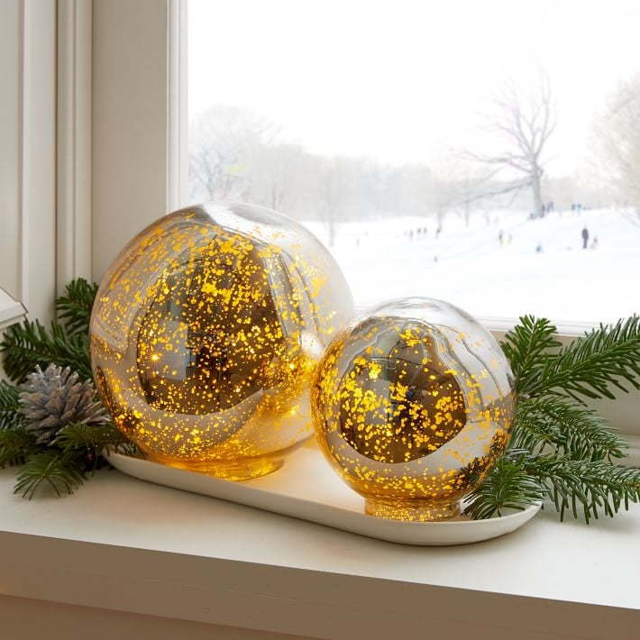 Glittering gold mercury orbs featured in West Elm's 2020 holiday decor collection.