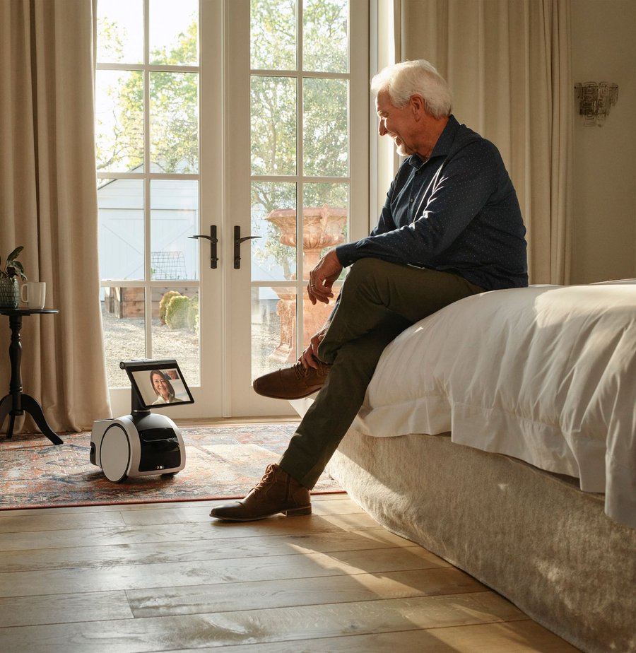 Elderly man has a video call with his wife using his handy Amazon Astro robot helper.