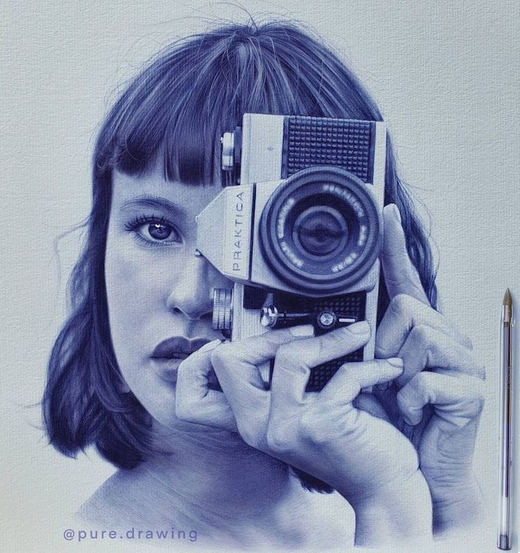 Photorealistic drawing of a woman behind a camera by Paulus Architect, all done using a ballpoint pen. 