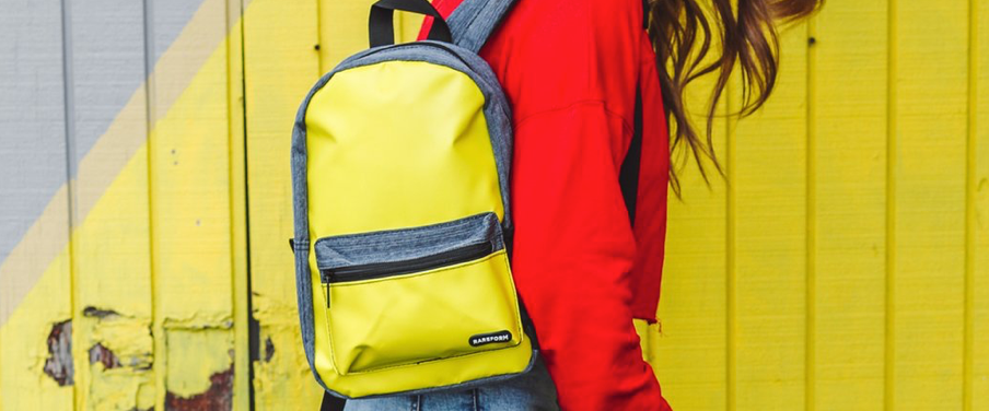 A vivid yellow backpack from sustainable surf apparel company Rareform.