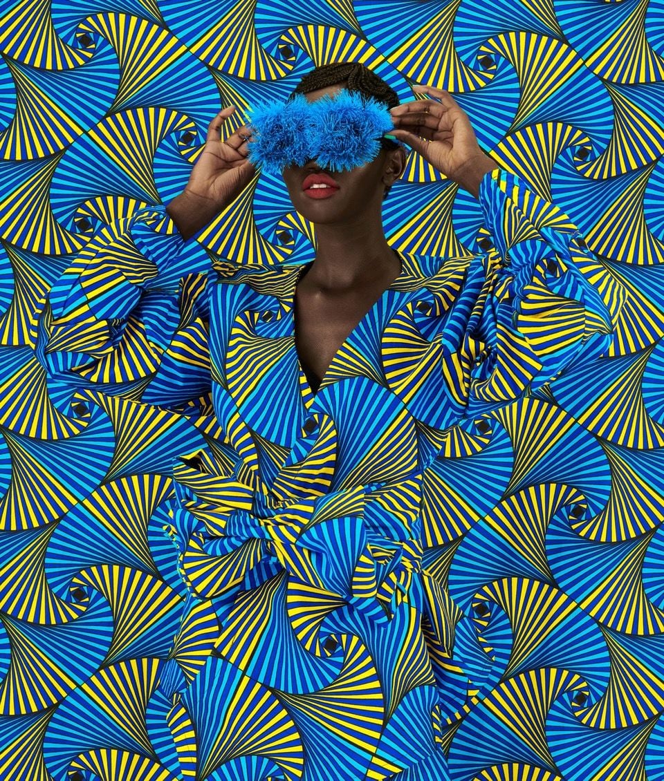 Kenyan woman dons a bold hairstyle and vibrant patterned textiles for artist Thandiwe Muriu's 