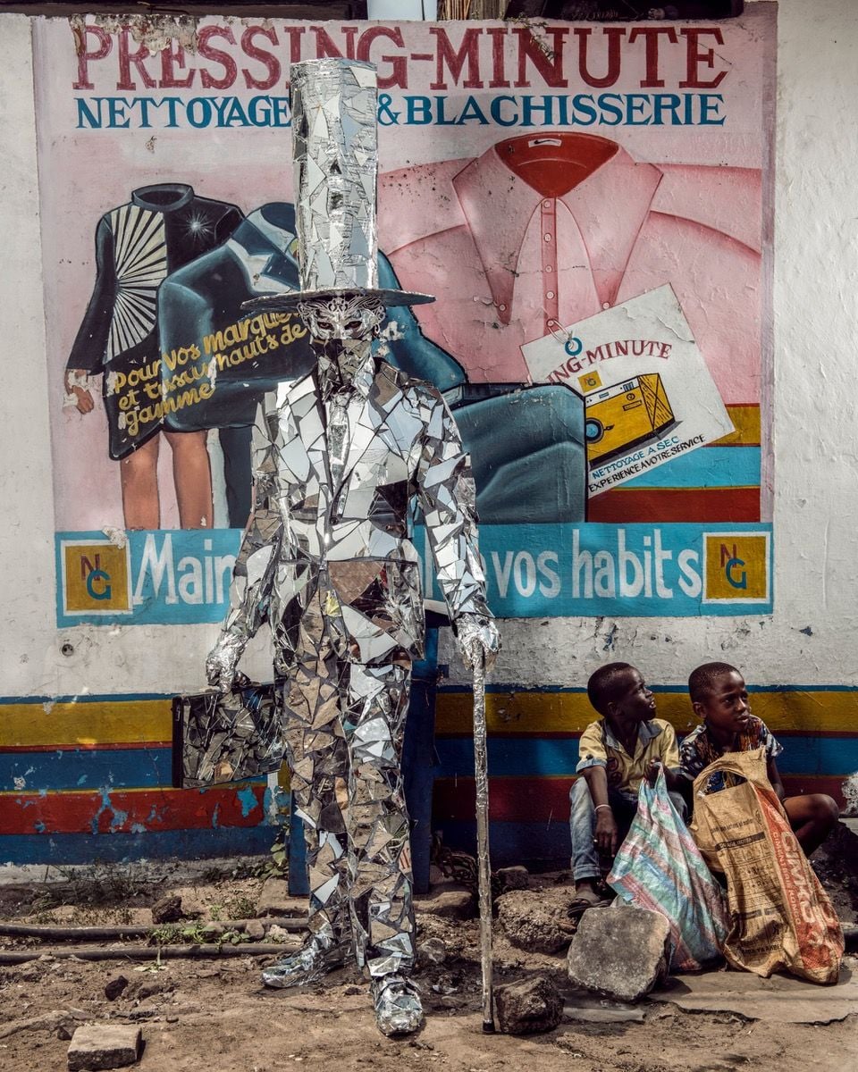 Striking Congolese protest art costume made from mirror shards, as captured by photographer/reporter Stephen Gladieu in his new book 