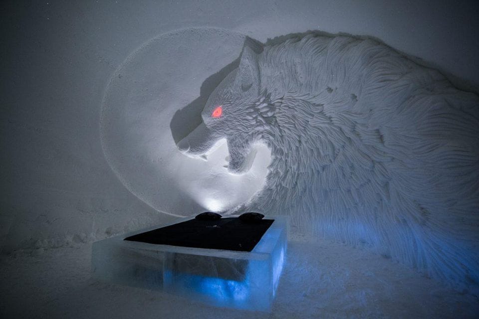 Jon Snow's trusty dire wolf Ghost beams down at hotel guests with a glowing red eye.