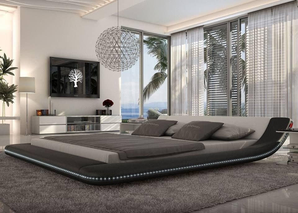 THis ultramodern bedroom makes ample use of black and gray and makes the large bed the star of the show. 