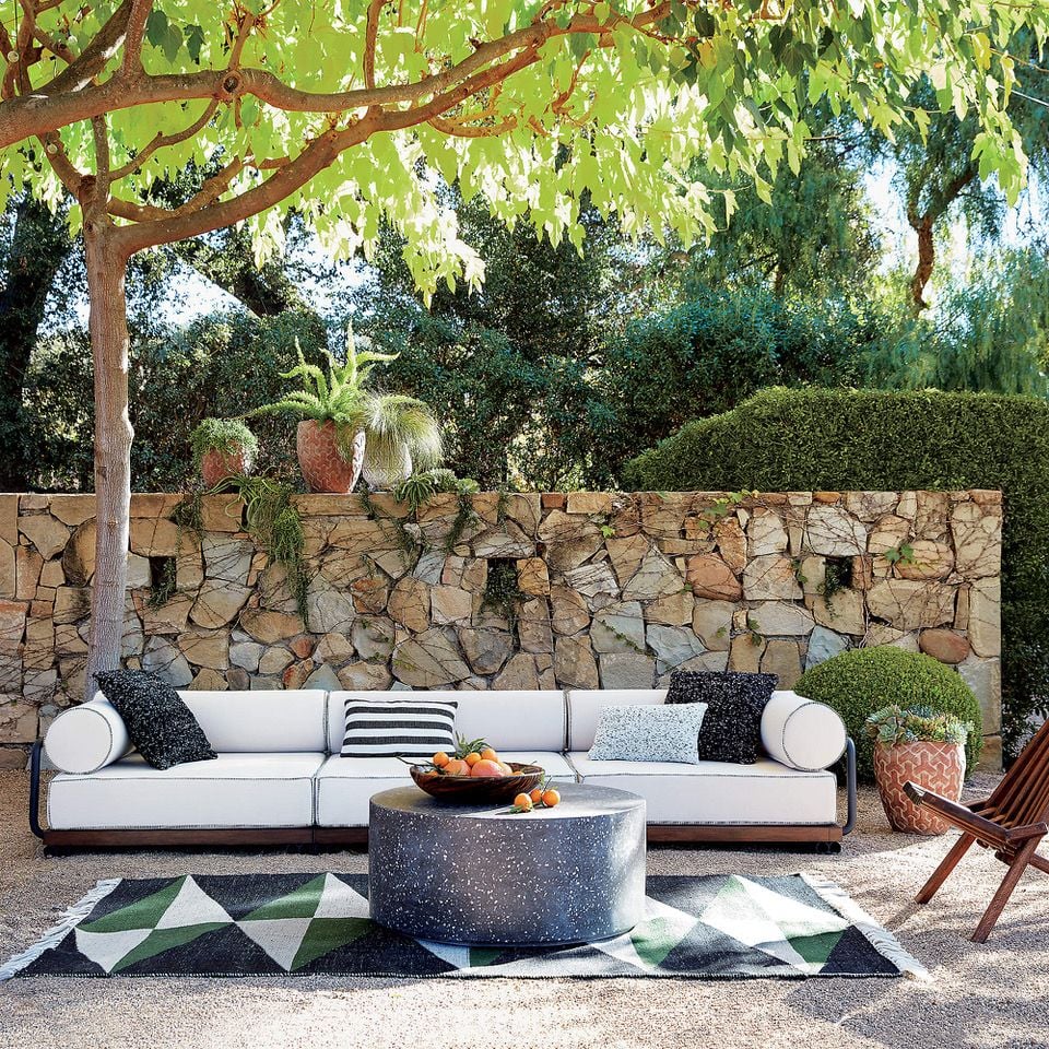 Sleek spring patio furniture (including the Terrazzo Black Coffee Table) now on sale at CB2.