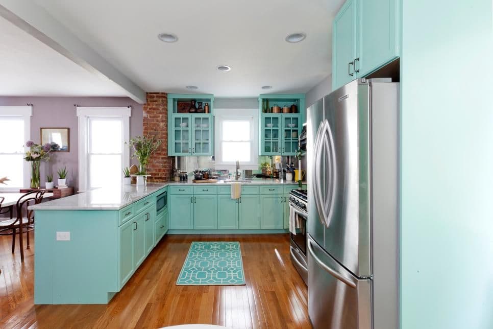 Kitchen decked out with pastel shaker cabinets like those featured in 
