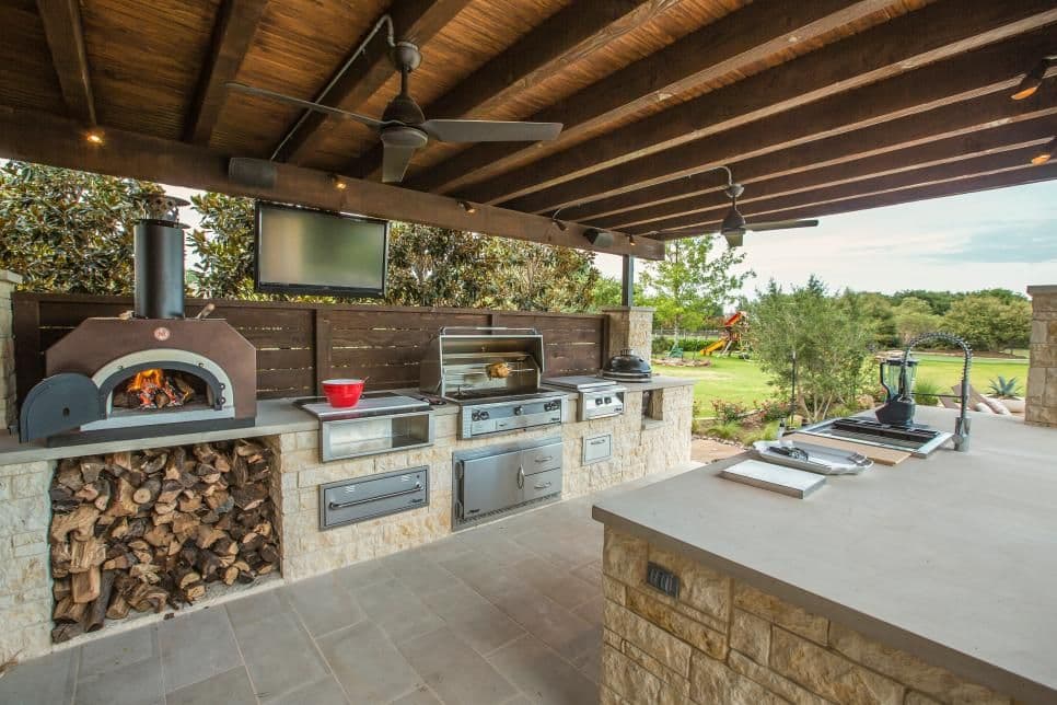 Large outdoor kitchen complete with ample grill and pizza oven space.