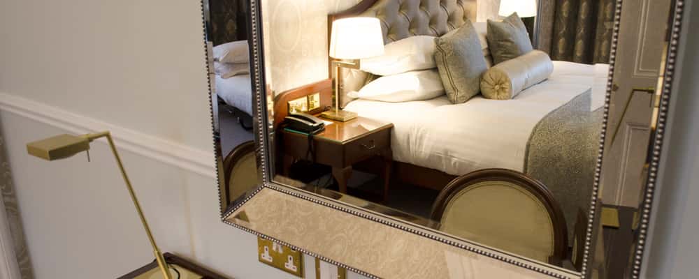 Bed reflected in mirror