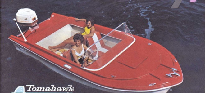 boat in the water in an old magazine ad