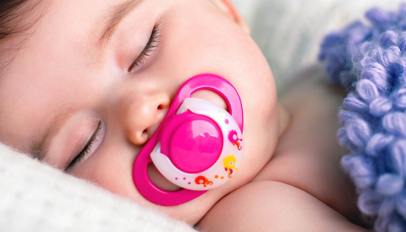 Baby sleeping with pacifier