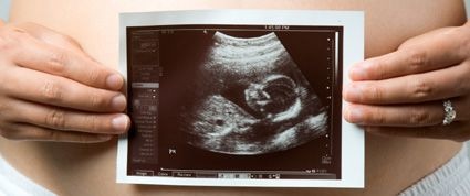 holding up ultrasound