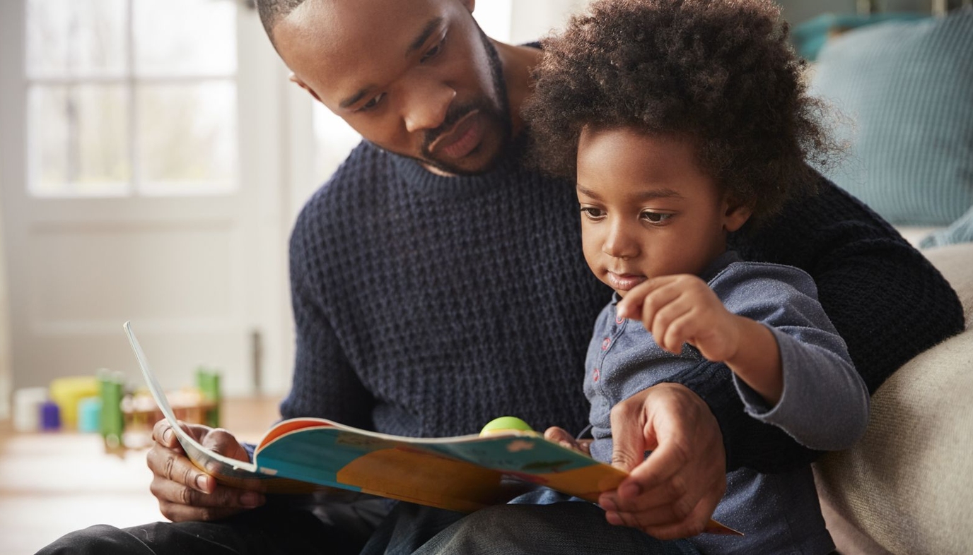 father reading to son