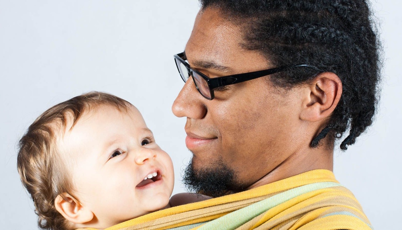 dad carrying baby in baby wrap