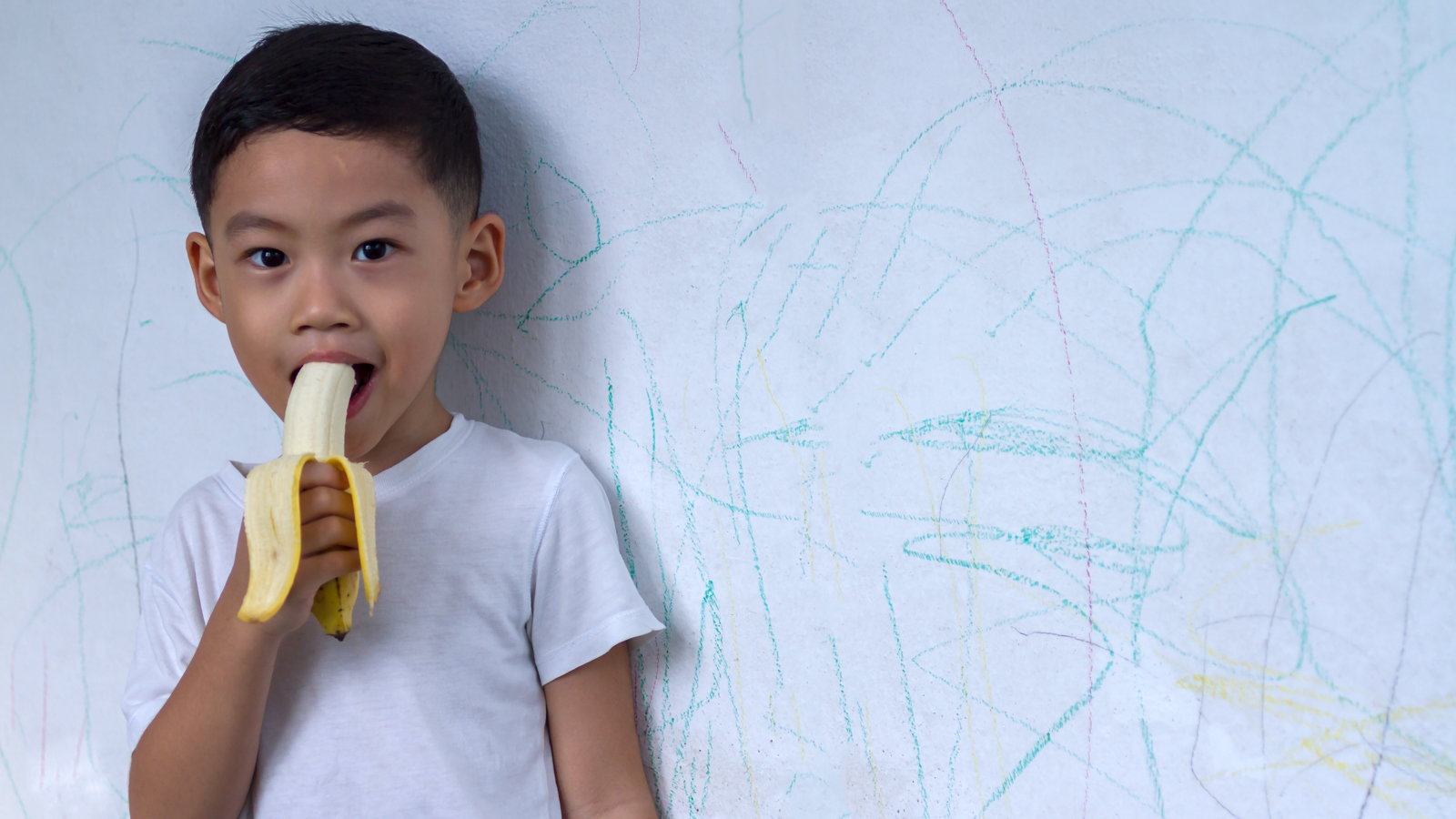 boy eating banana