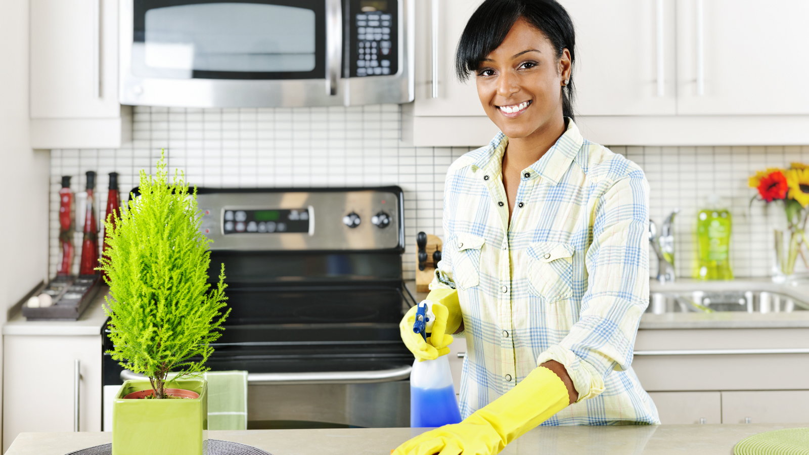 woman cleaning countertop