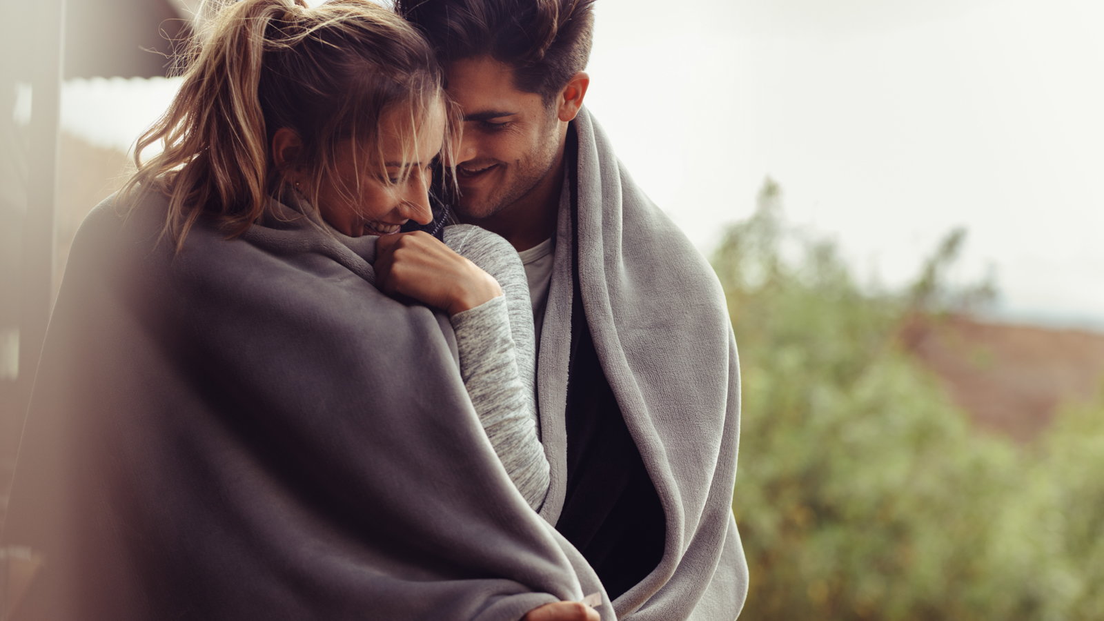 couple wrapped in blanket