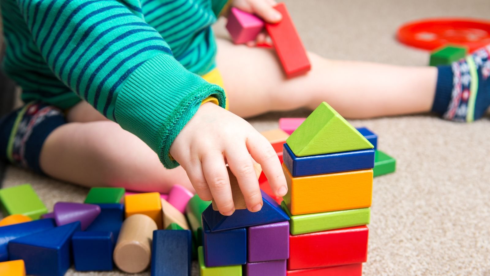 baby playing with legos