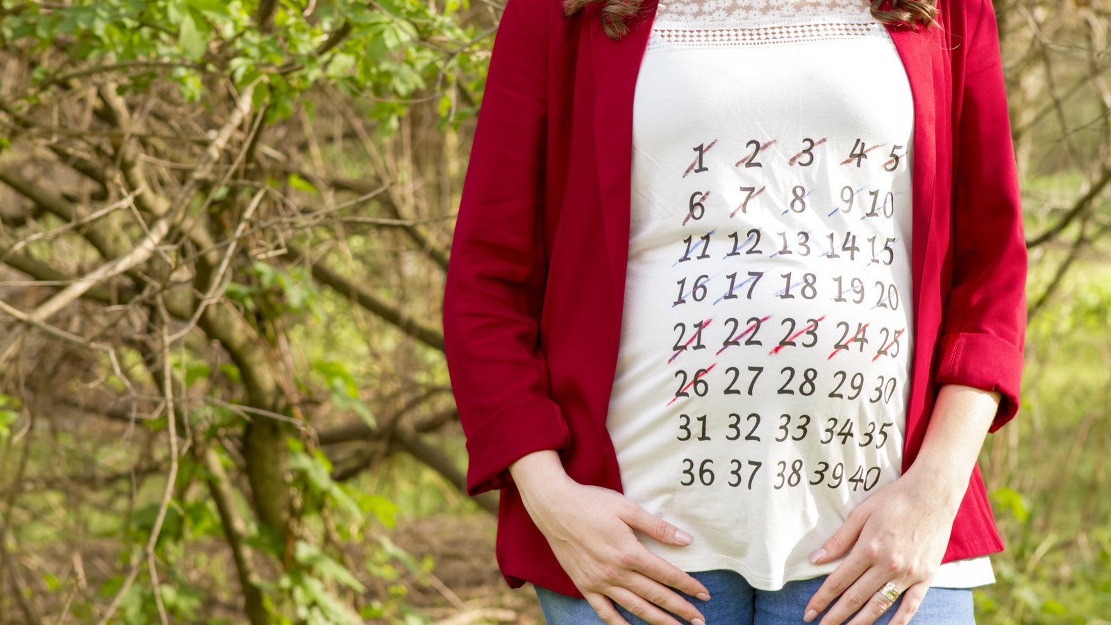 pregnant woman wearing a calendar shirt