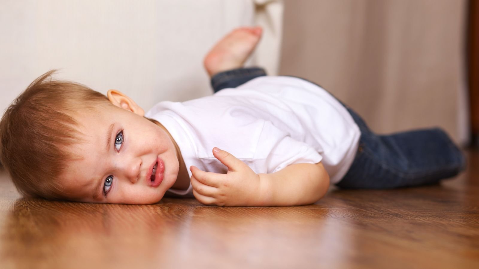 toddler crying on the floor