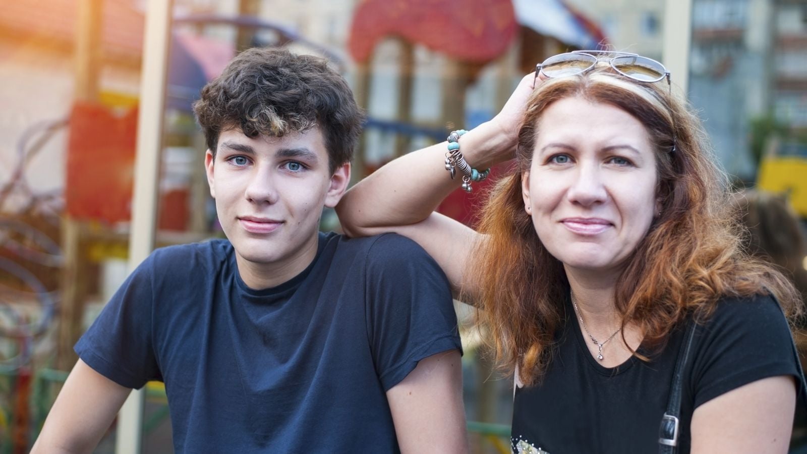 mom sitting with teen son