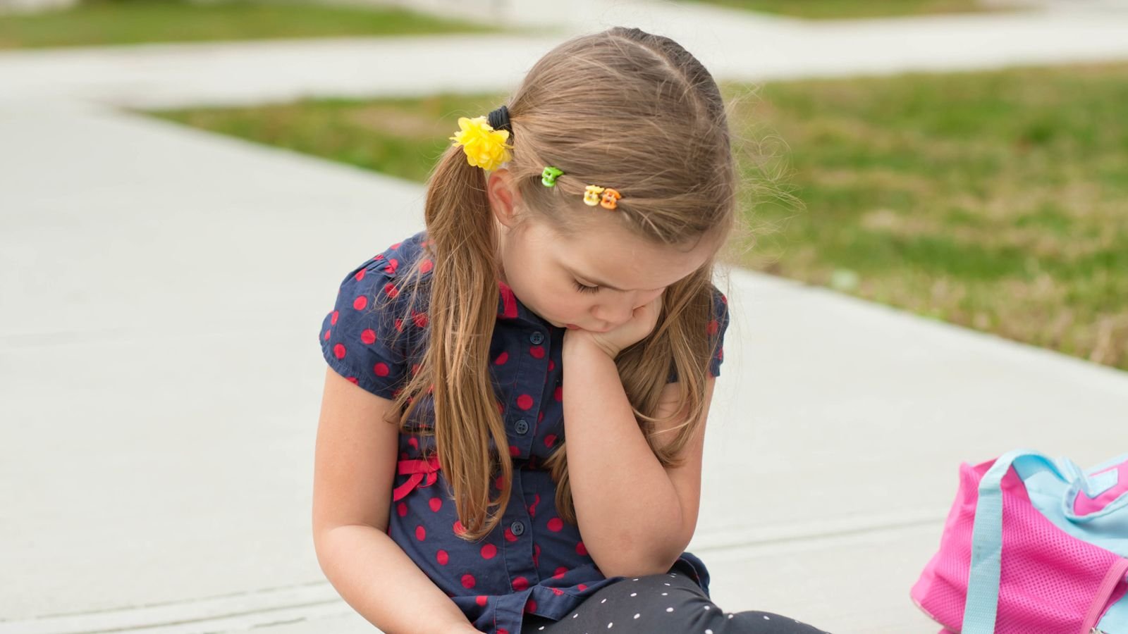 sad girl with backpack