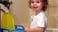 little girl standing by potty seat