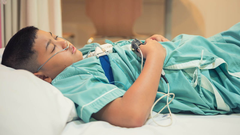 boy in the hospital with monitors connected to him