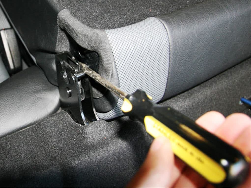 Press in the latch to remove the rear seat back