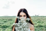 Girl holding field flowers