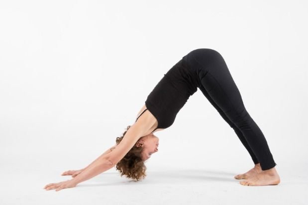 Woman doing Downward Facing Dog pose