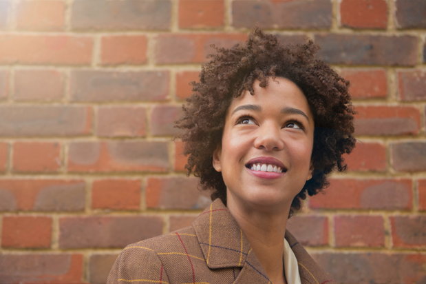 woman smiling and looking up