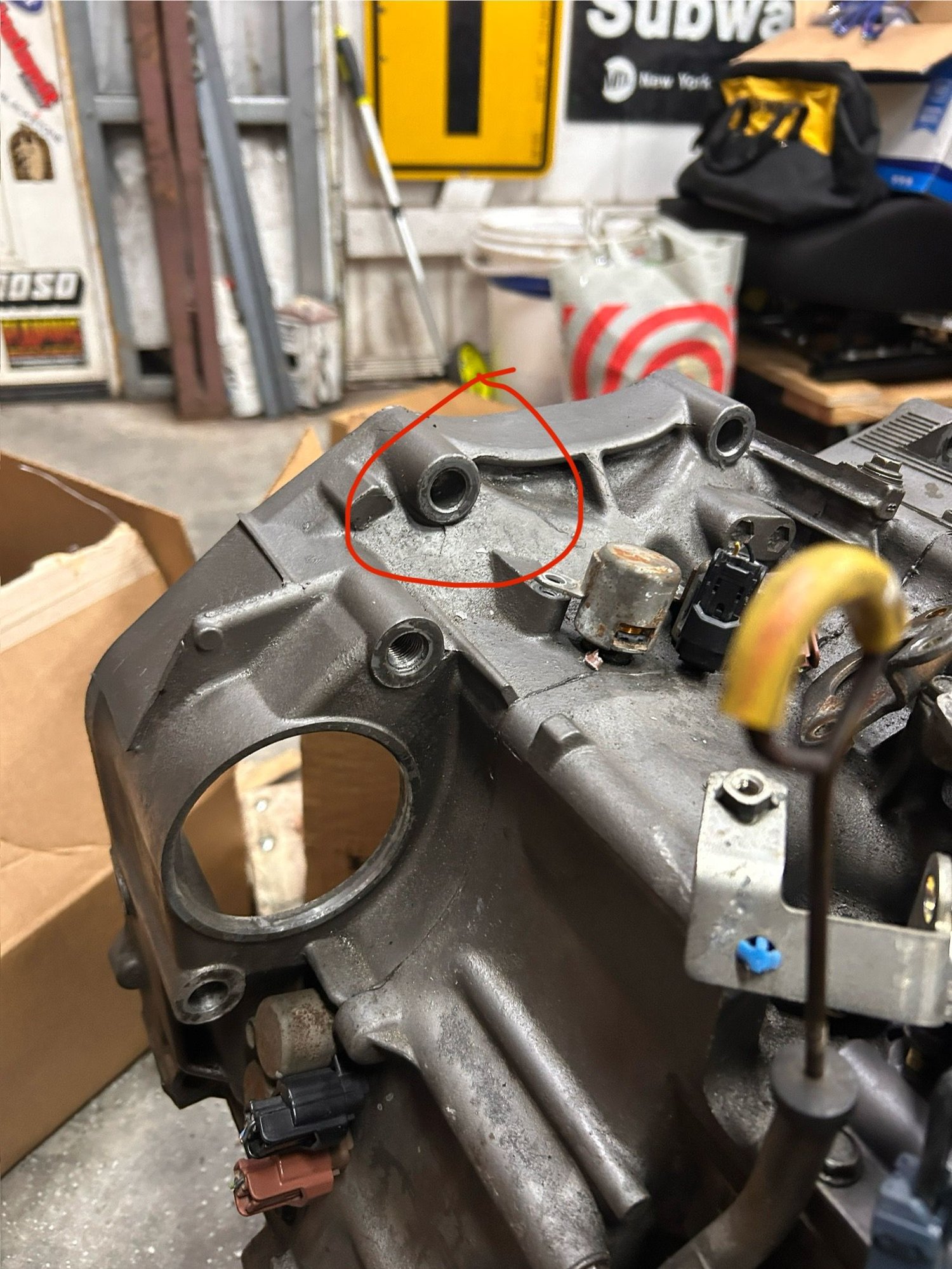 Took a pic of my old trans, that�s where the bolt I was talking about goes. I don�t know what is past that bolt that I could�ve punctured/broke