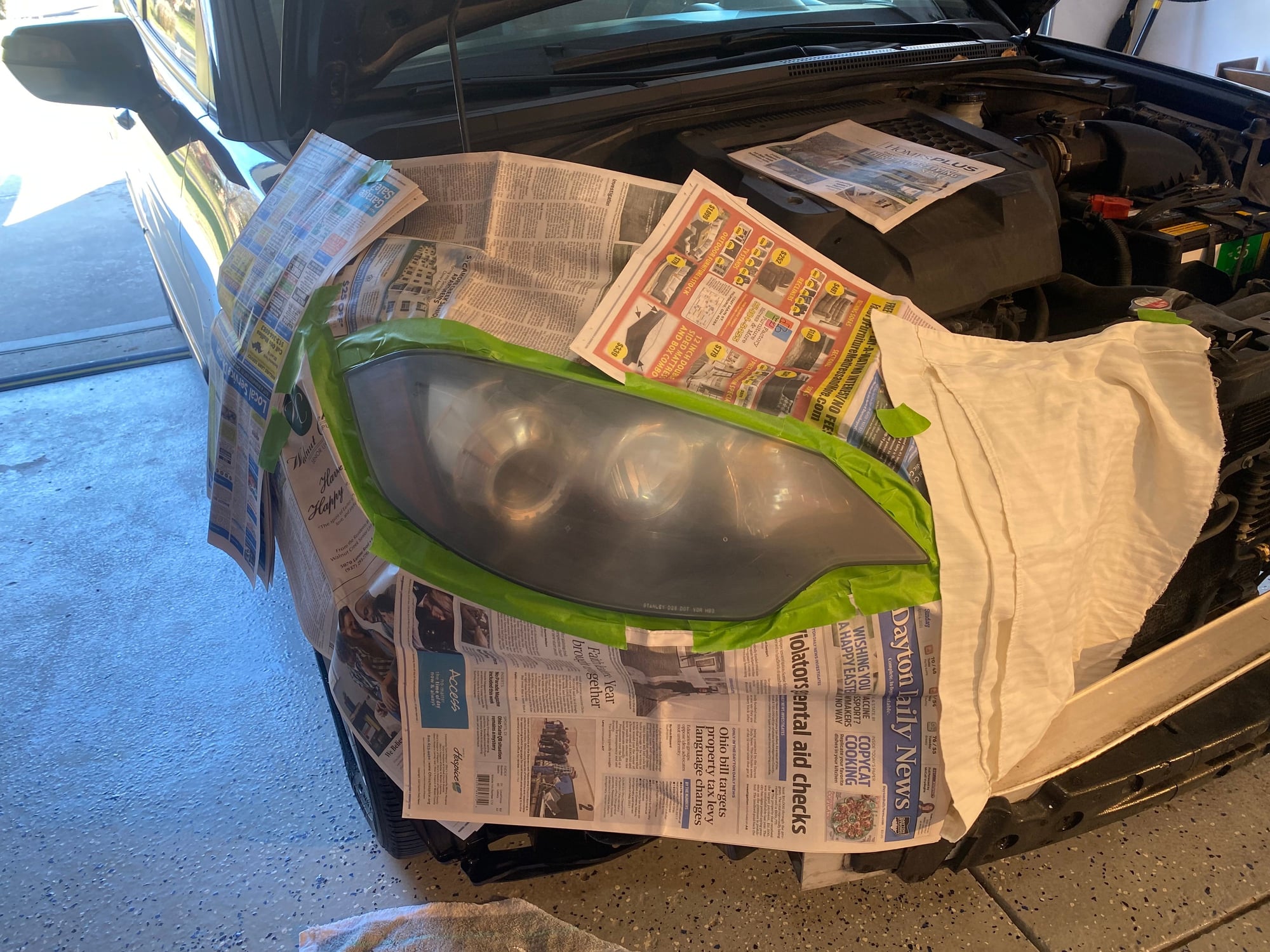 How to Restore Faded Plastic Headlights Using Clear Coat 