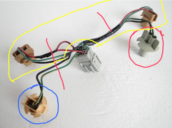 Yellow area is your brake-grn/wht and the running lamps are red/blk.

Blue area is turn signal-grn/yel rt side tail light ; grn/blu lt side tail light.

Red area is reverse lamp do not cut, use as is.

Cut as marked at red vertical lines and plice into the LED Depol lamps.