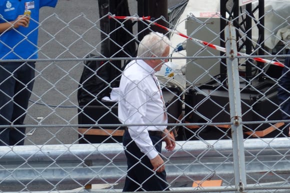 Charlie Whiting inspecting the repairs made to the Armco post-crash
