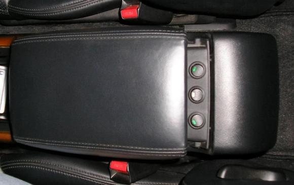 Hidden switches in armrest slide.