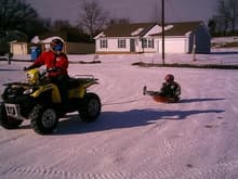 Pulling Brier-Ashley in the wheel barrow tub. Hey, we don't get much snow in the South!                                                                                                                 