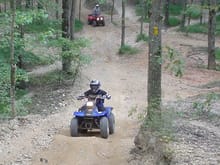 My Son Climbing Hills at Turkey Bay OHV on his Yamaha Breeze 125 as Mom waits at the bottom for her turn on her Prairie 300. Sept 12, 04                                                                